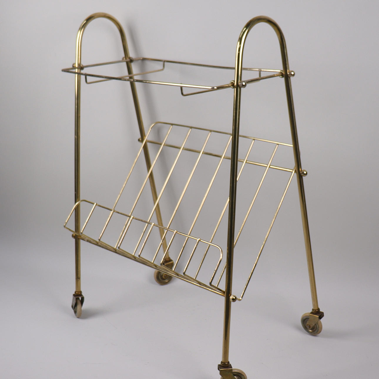 MAGAZINE RACK, brass, mid-20th century.