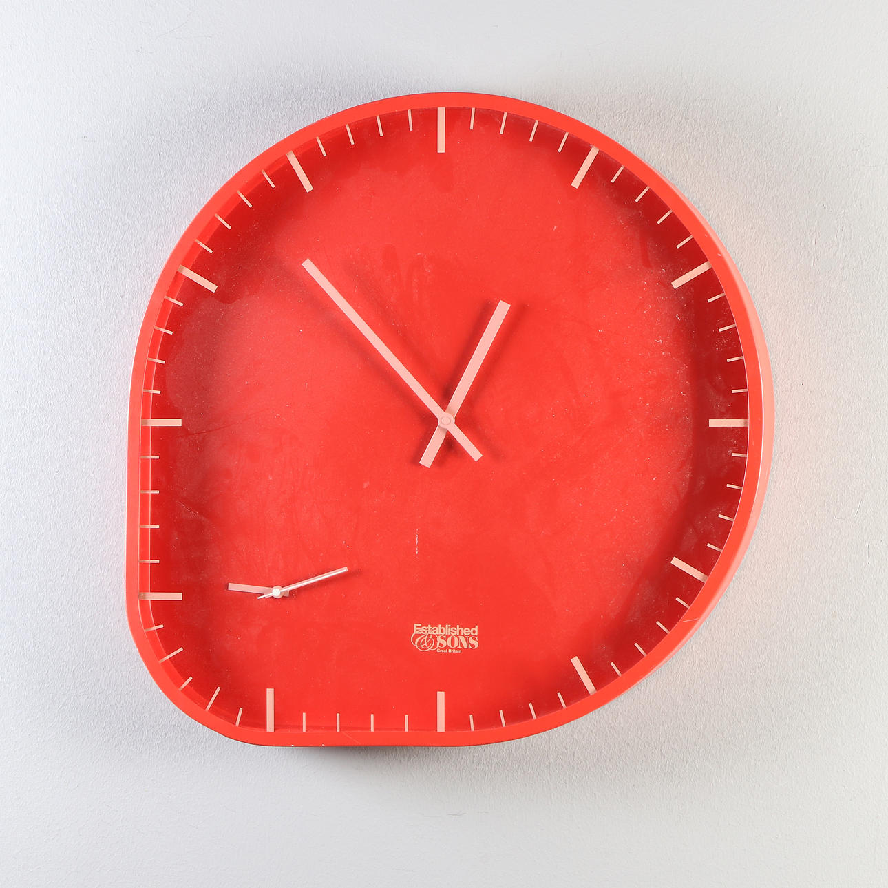 ESTABLISHED & SONS, WALL CLOCK. Red plastic. Two Time. Contemporary production.