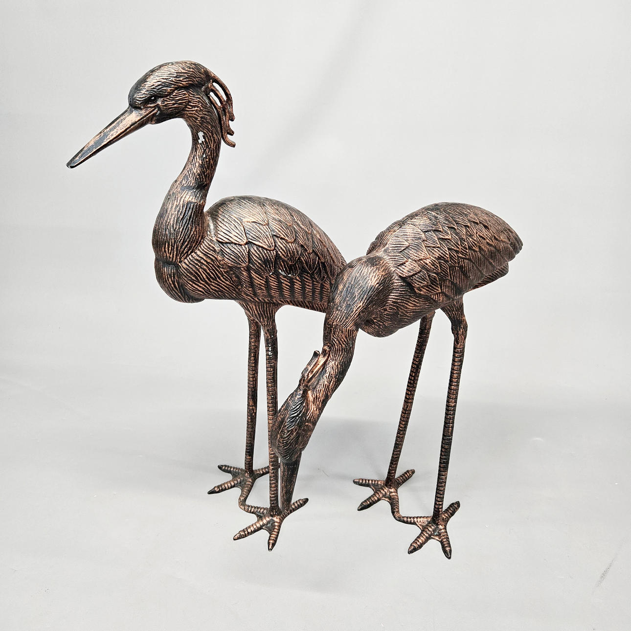 CAST METAL HERONS.