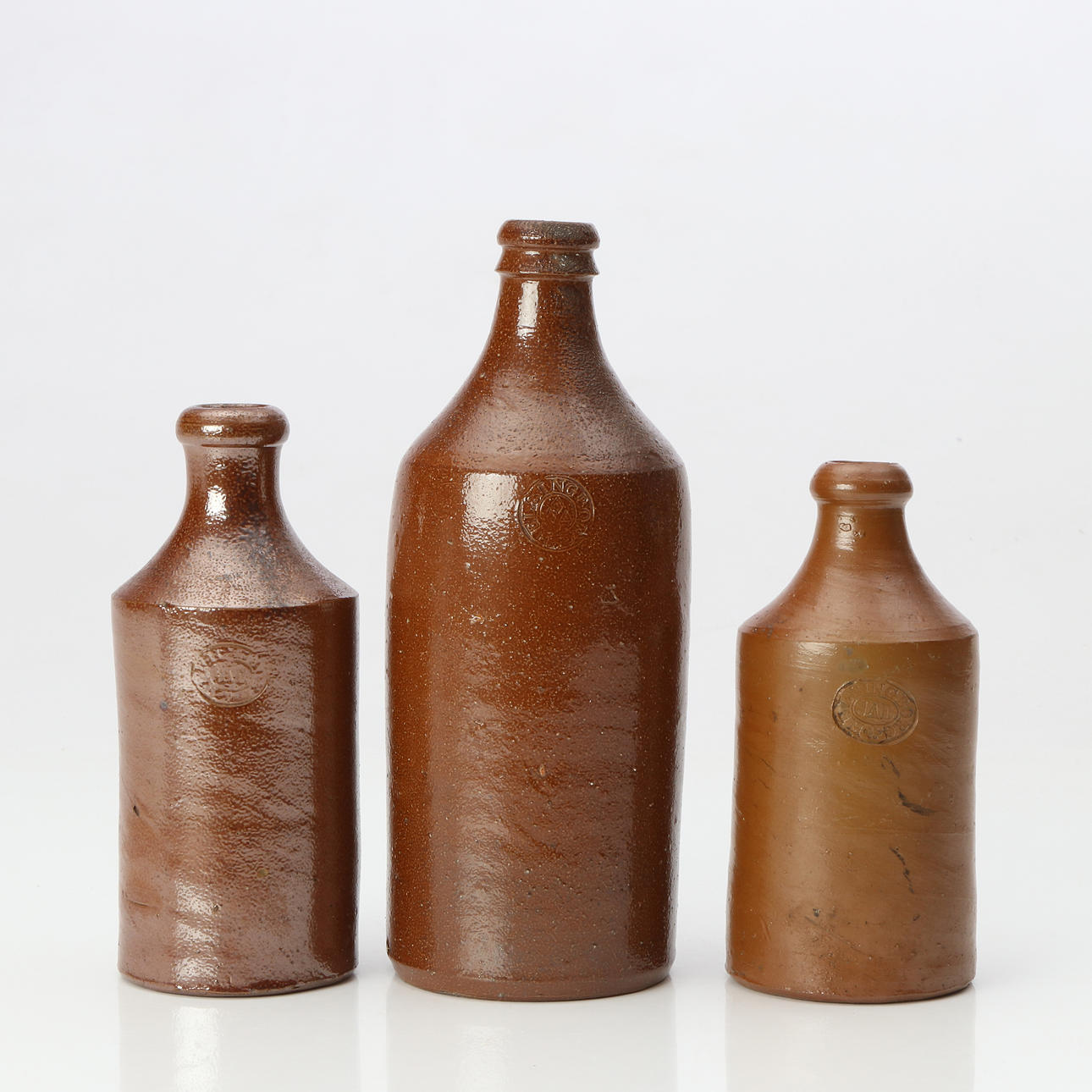 HELSINGBORG, BOTTLES, THREE. Salt-glazed stoneware. Two by Johan August Dreilick 1831-1869 and one from Helsingborg 1798-1830.