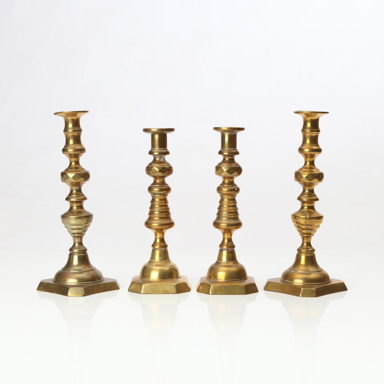 CANDLESTICKS, TWO PAIRS. Brass. 19th/20th century.