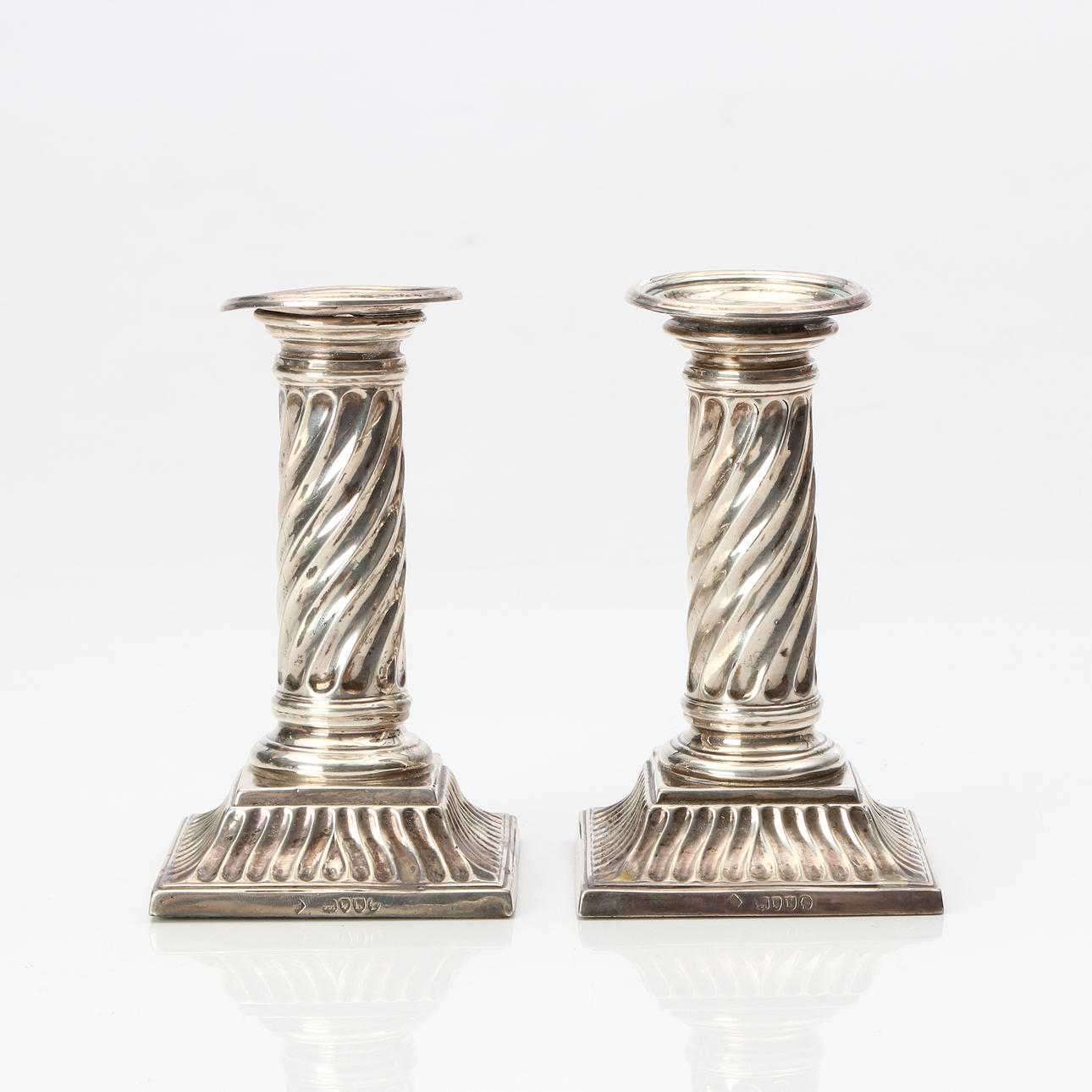 CANDLESTICKS, A PAIR. Silver, with weighted bases. 20th century.