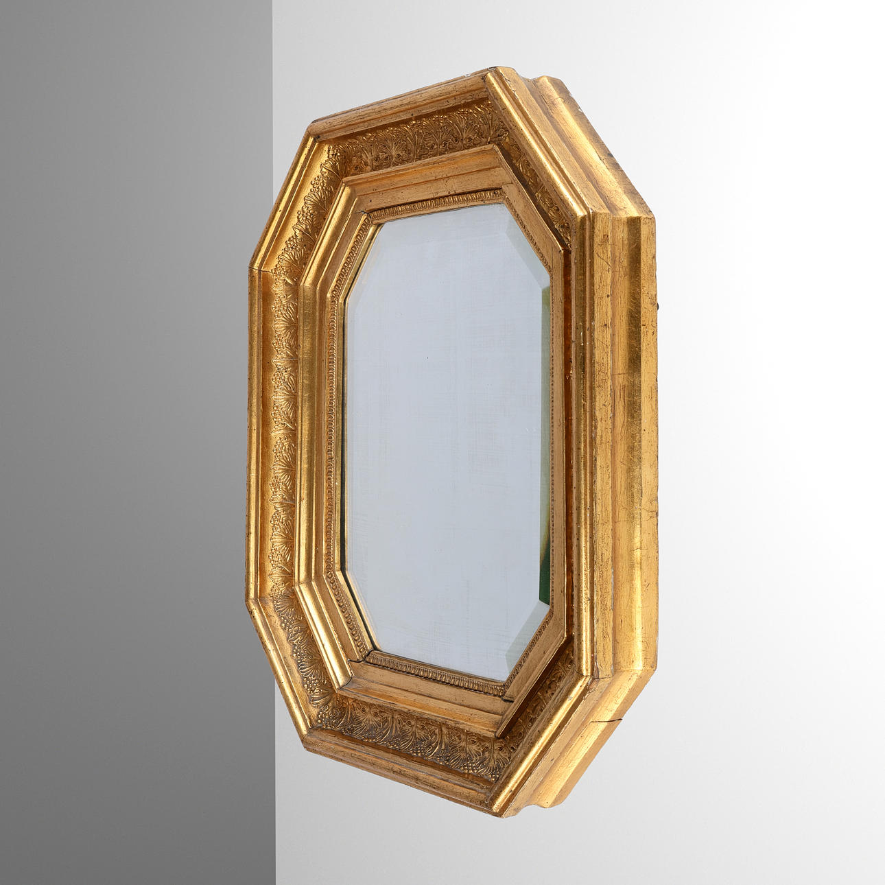 Octagonal gilt mirror, Late Empire, mid-19th century.