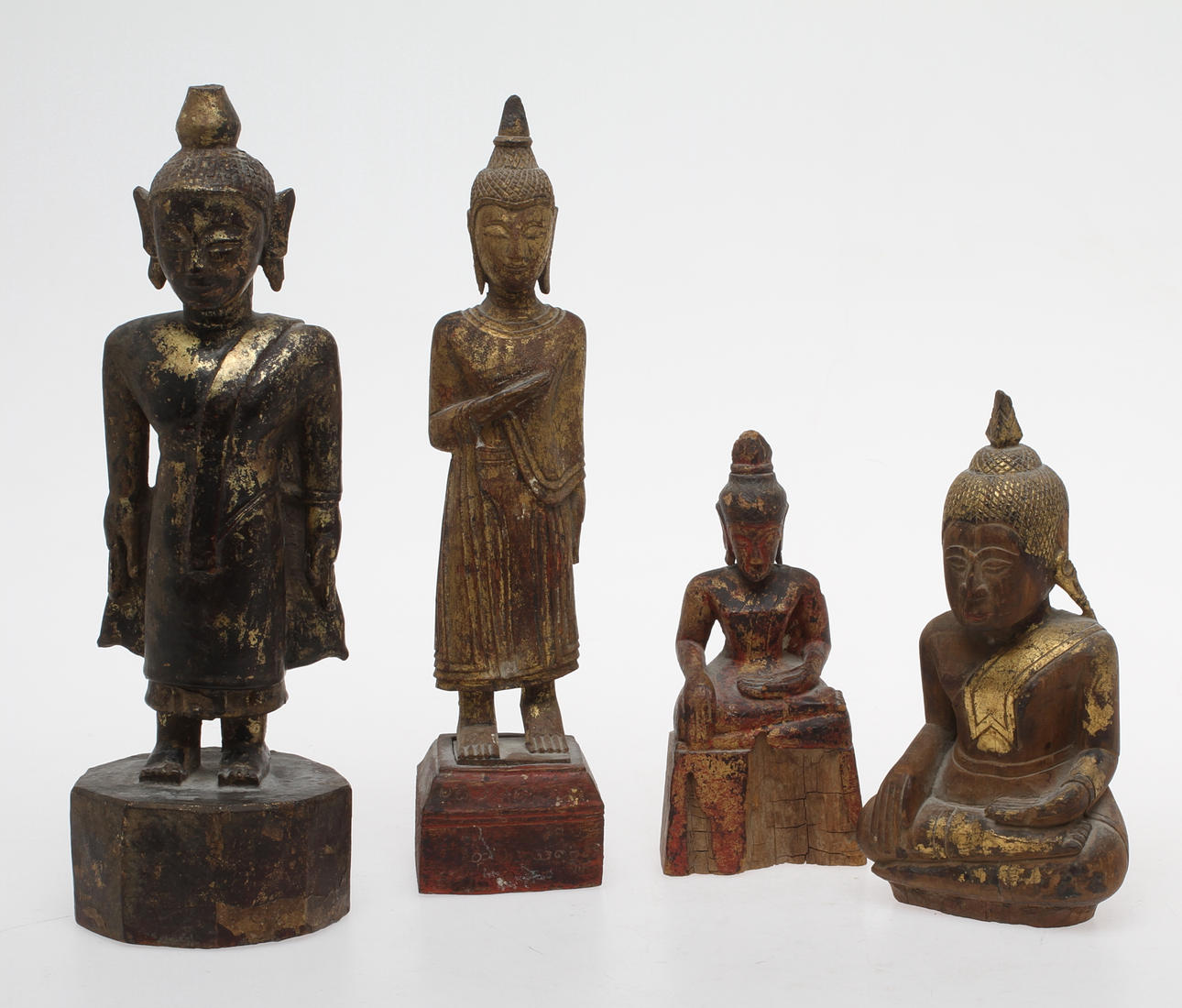 BUDDHOR, 4 st, skuret och patinerat trä.