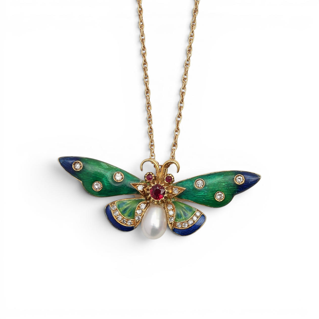 Butterfly-shaped gold pendant.