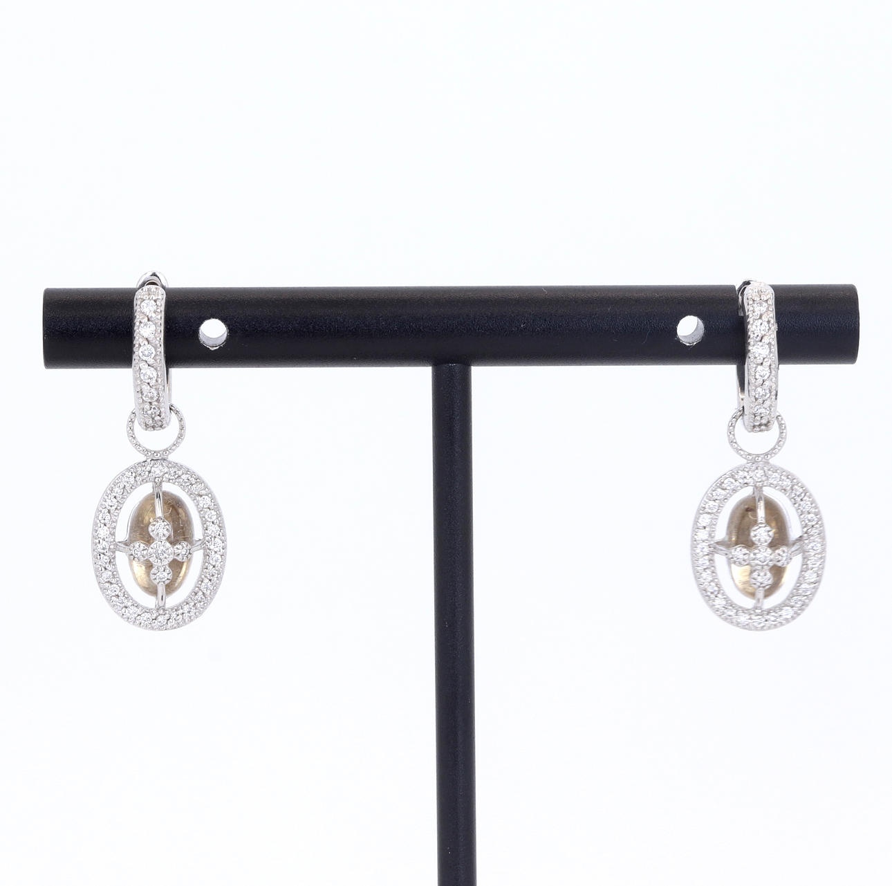 9CT WHITE GOLD DIAMOND SET DROP EARRINGS.