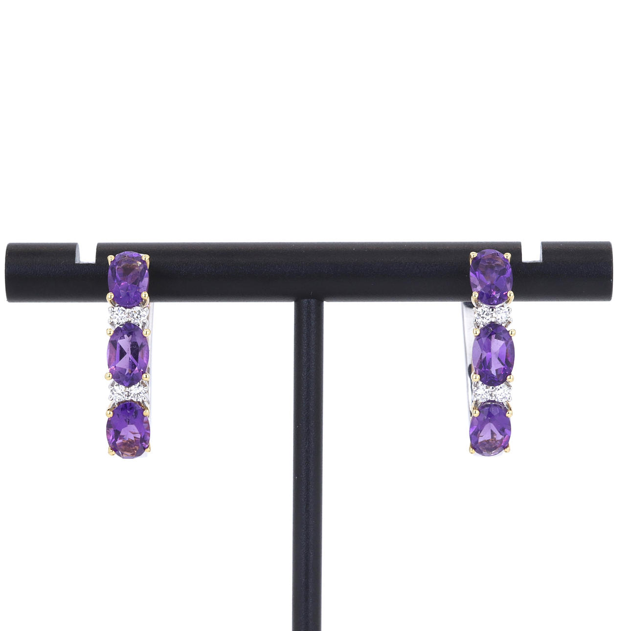 18CT AMETHYST & DIAMOND SET RING.