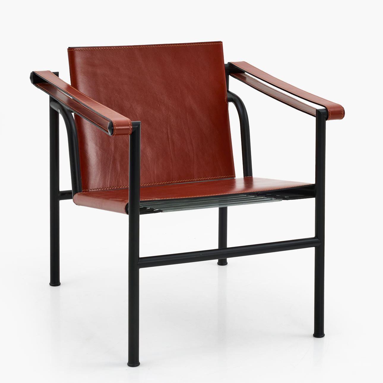 LE CORBUSIER. "LC 1", karmstol, Cassina, formgiven 1928, stomme av svartlackerat stål, klädda i brunt läder