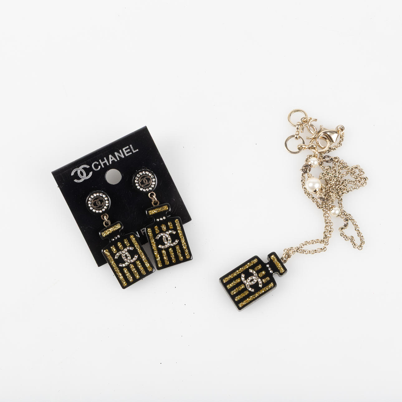 CHANEL, set, pendant with chain and earrings.