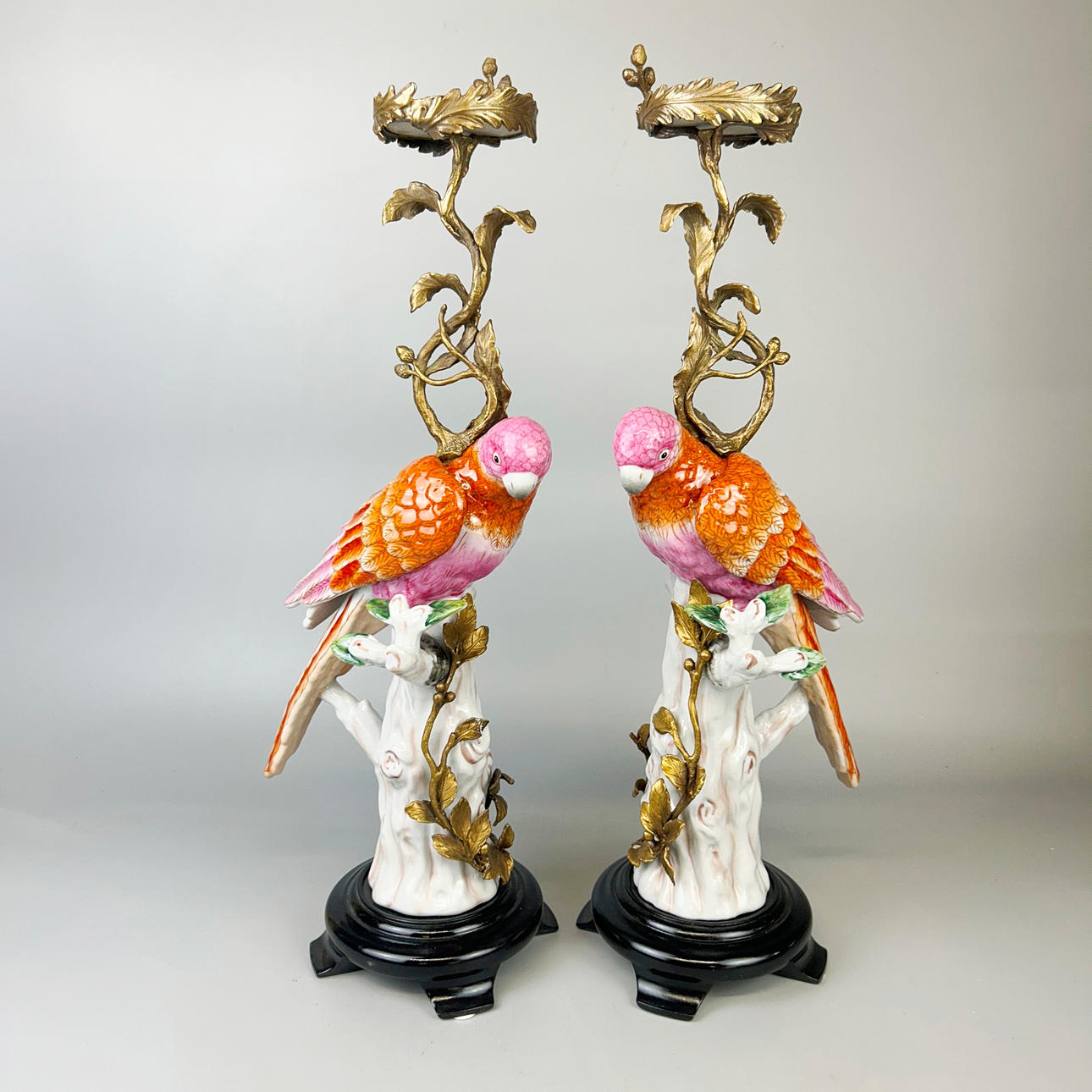 PORCELAIN PARROT CANDLESTICKS.