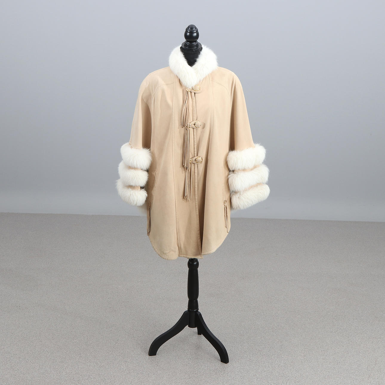 FUR-TRIMMED CAPE. Light suede with white mink.