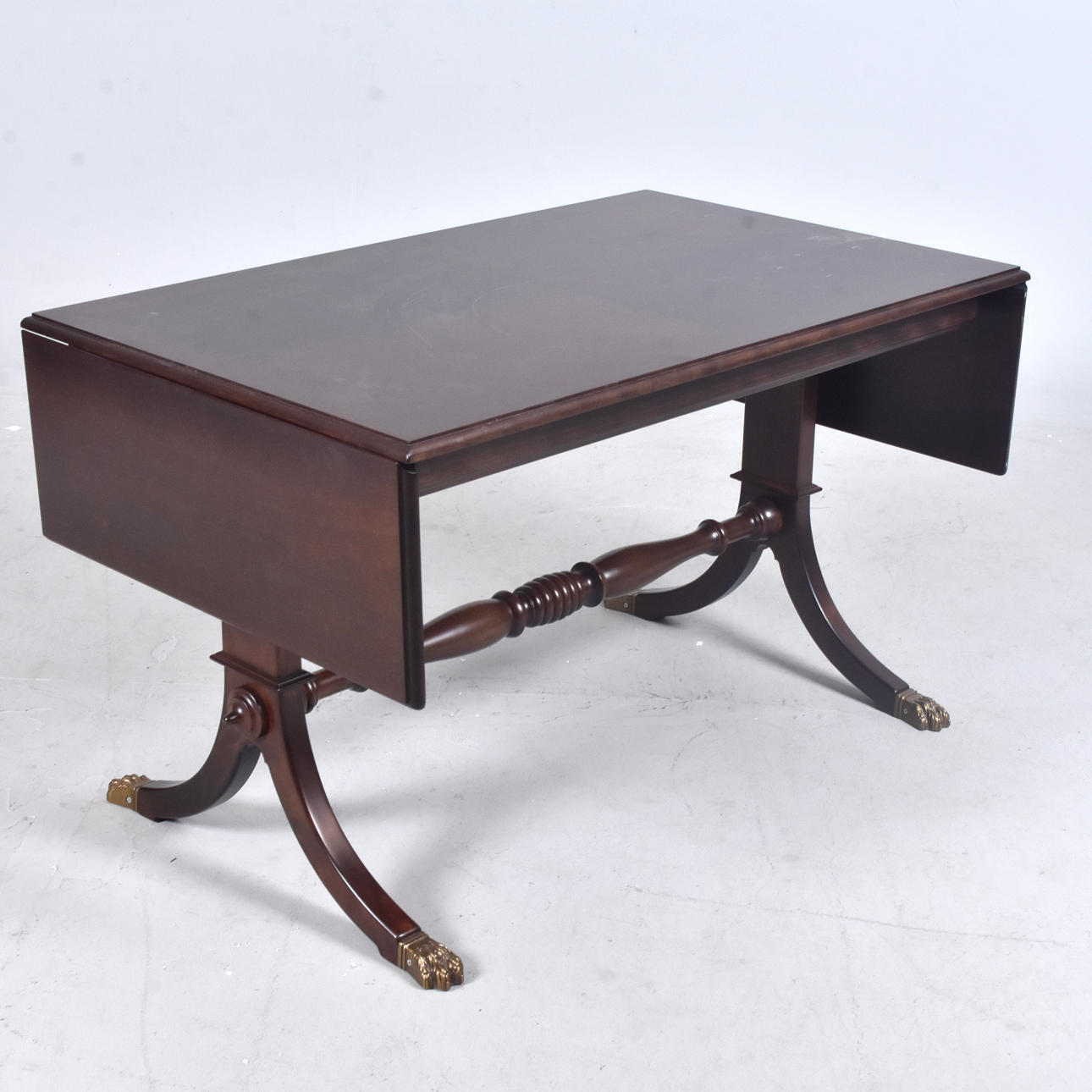 DROP-LEAF TABLE, mahogany with brass mounts, 20th century.