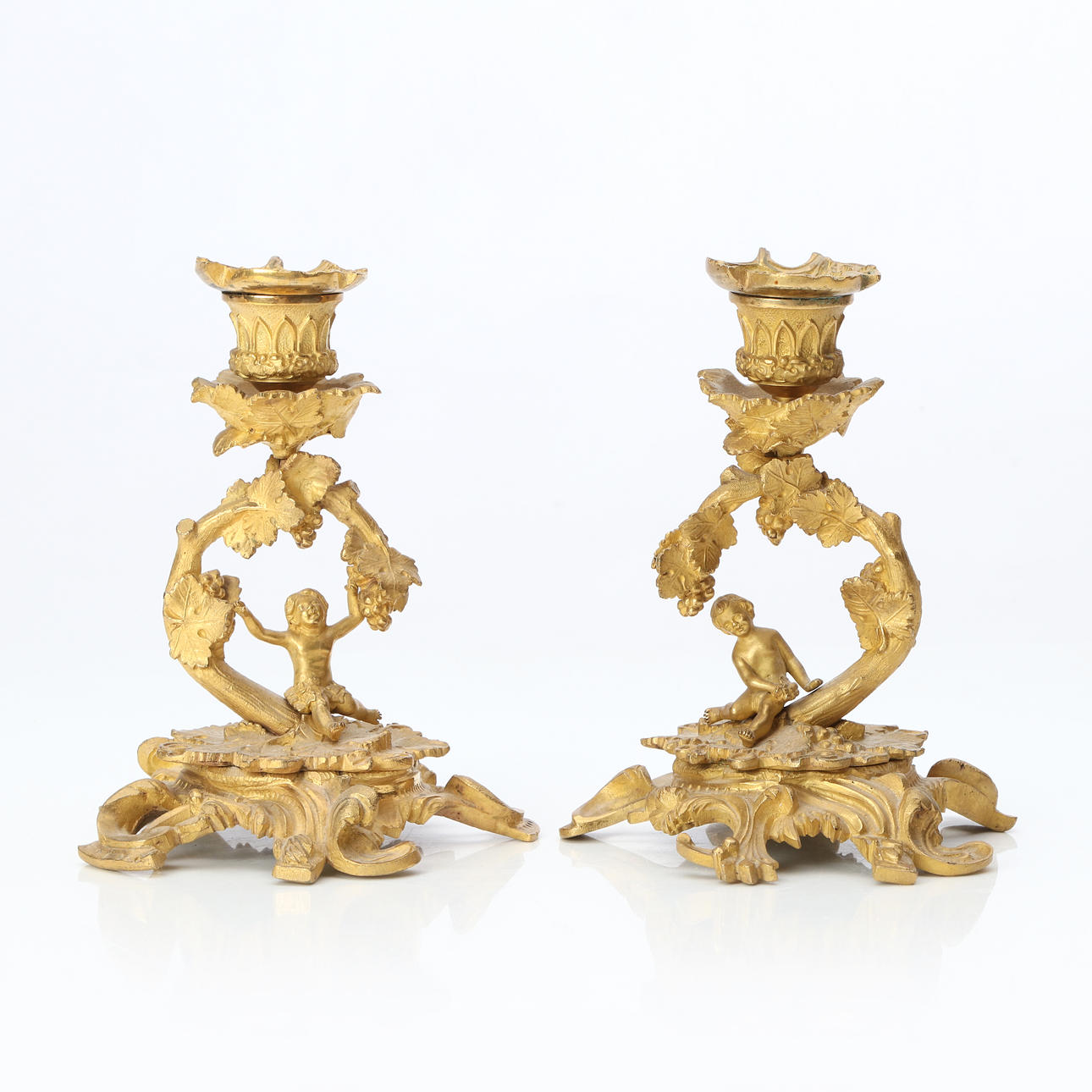 CANDLESTICKS, A PAIR. Gilt brass. Neo-rococo, 19th century.