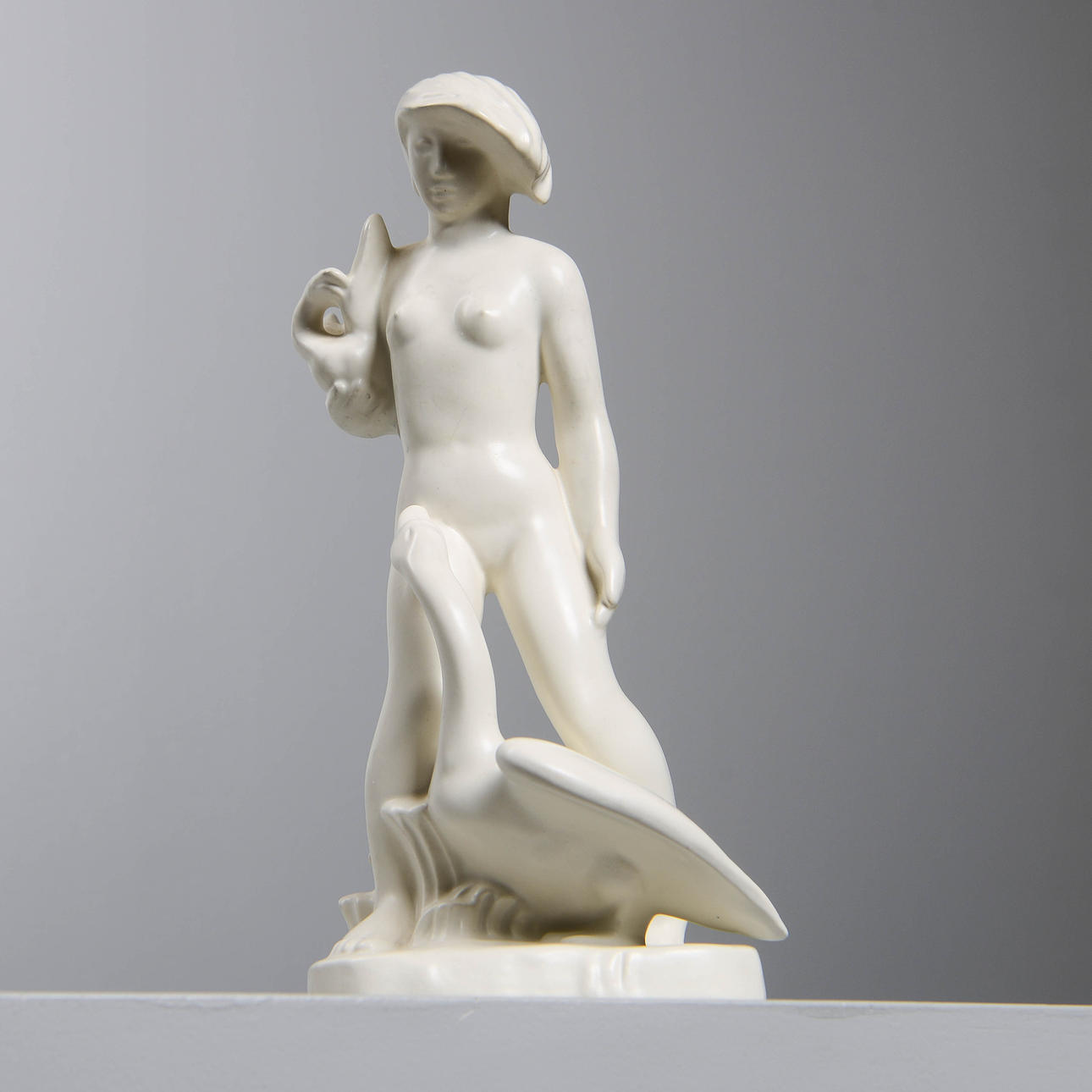 NILS E. HANSSON. Figurine, "Leda och Svanen", Gefle / Upsala-Ekeby, signed and dated -38.