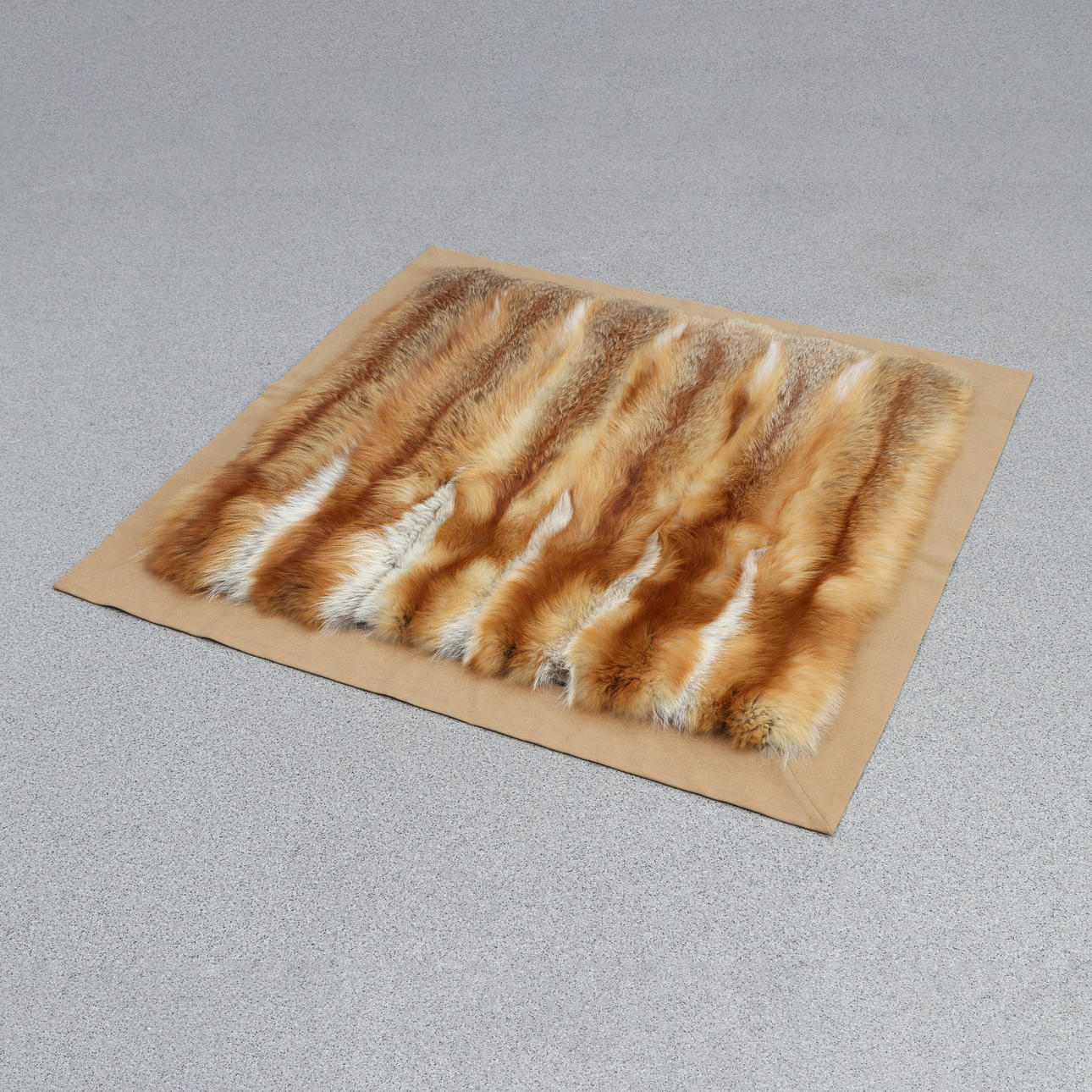FUR THROW. Red fox fur lined with beige wool.