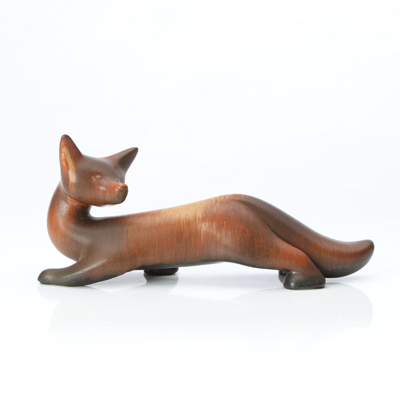 GUNNAR NYLUND. CERAMIC SCULPTURE. Glazed stoneware. Fox. Rörstrand. Signed underneath.
