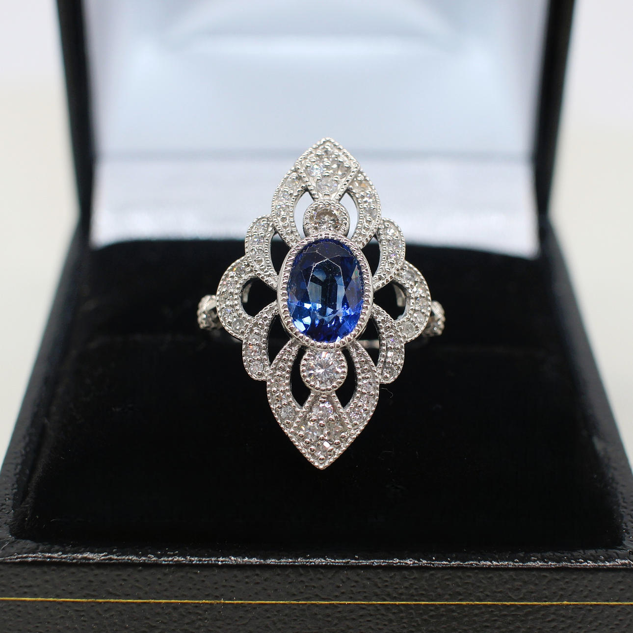 SAPPHIRE & DIAMOND MARQUISE SHAPED RING.