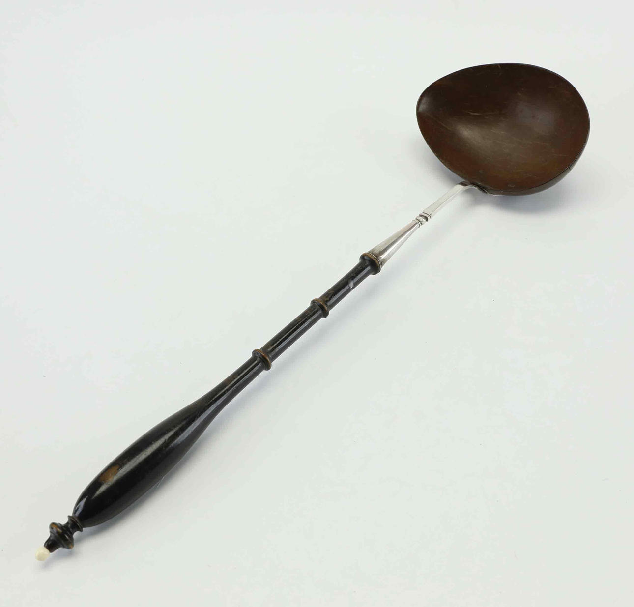 SOUP LADLE, silver with coconut, 19th century.