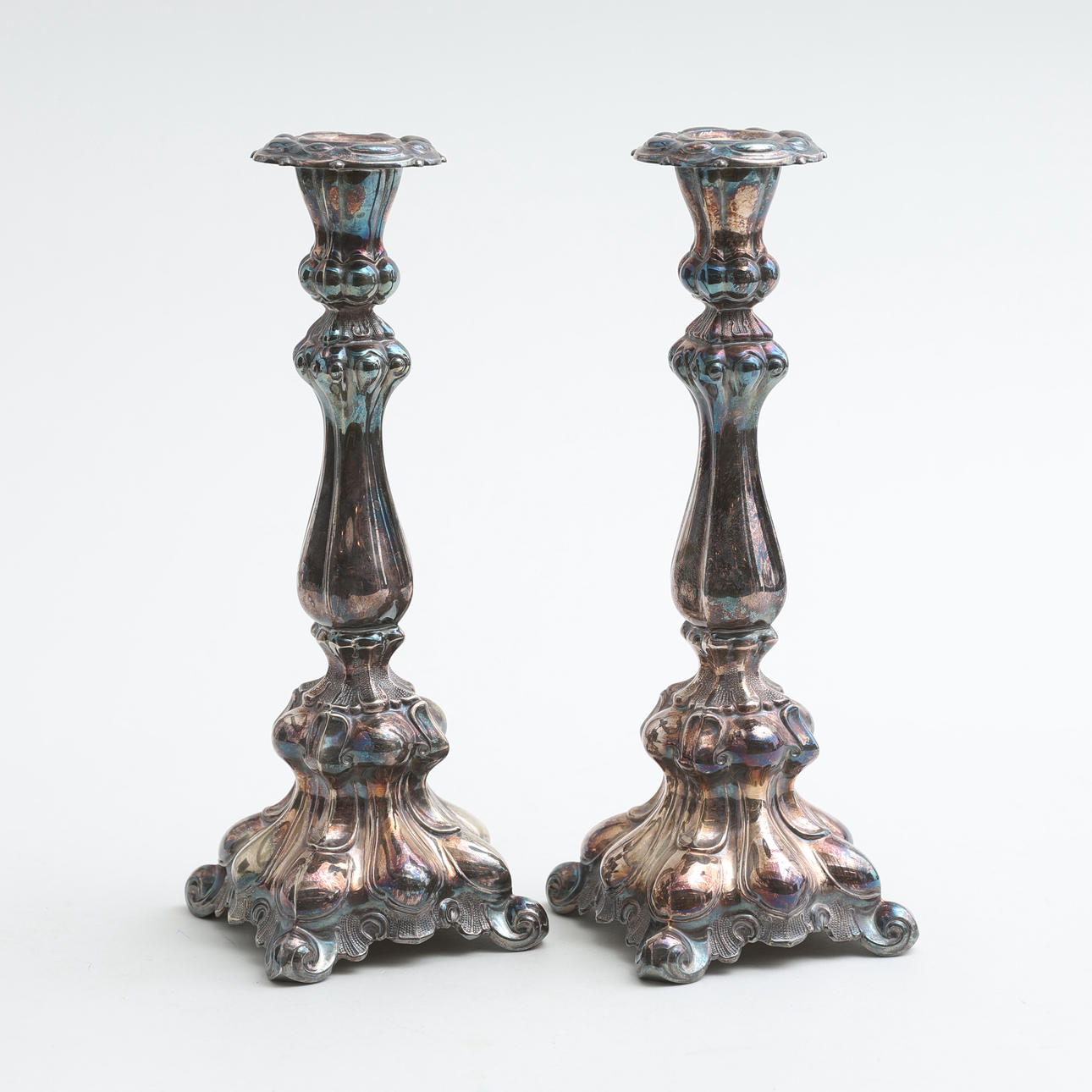 CANDLESTICKS, a pair, nickel silver, Baroque style, 20th century.