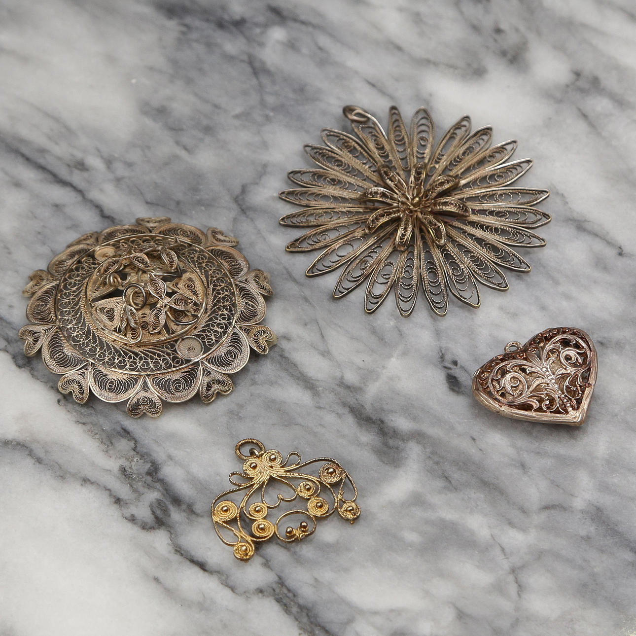 4 PENDANTS, SILVER, FILIGREE WORK.