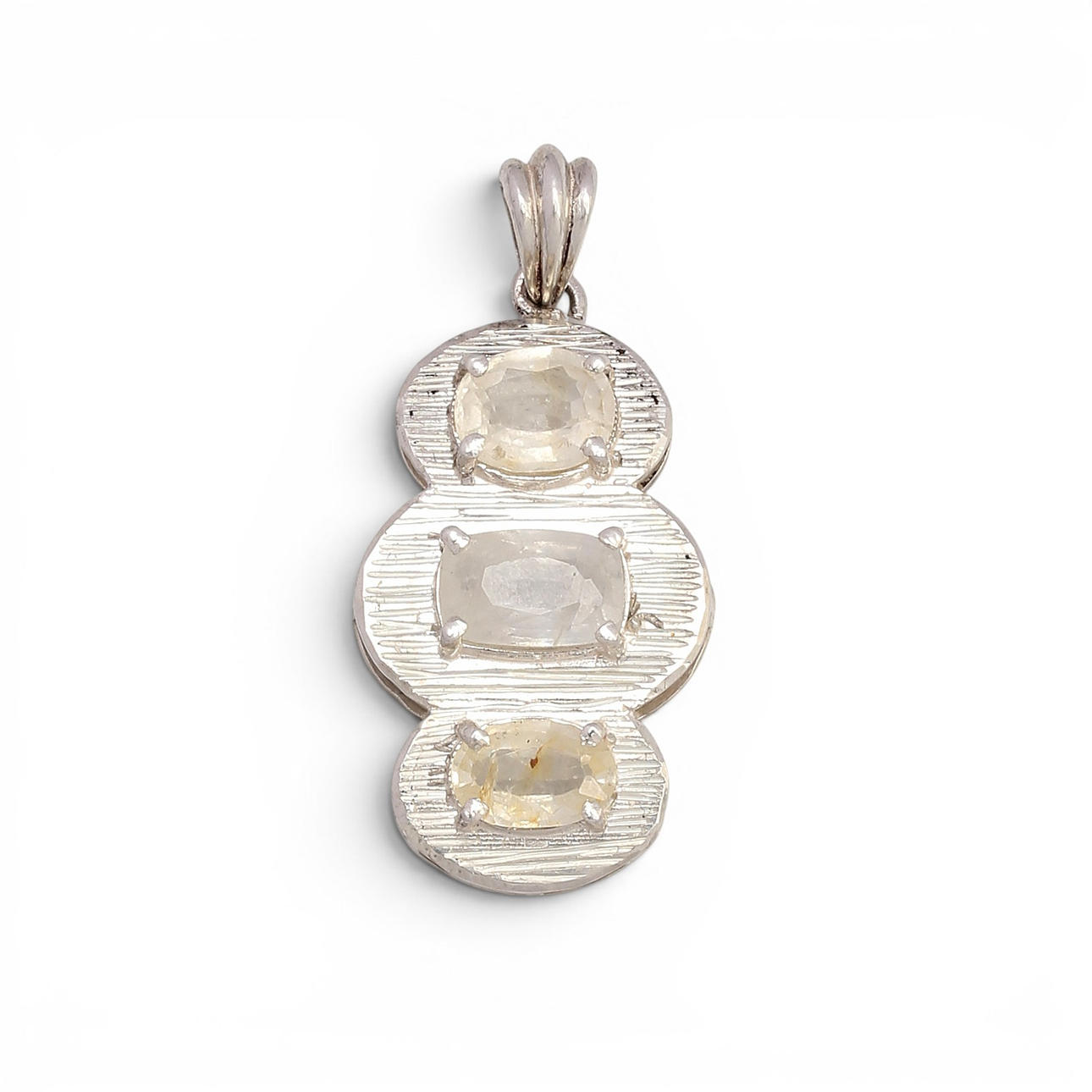 Pendant with three coloured sapphires.