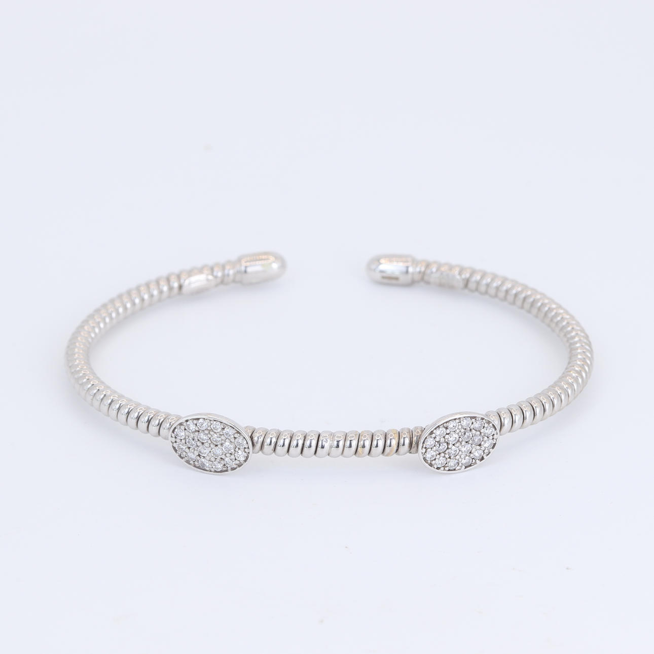 18CT DIAMOND SET BANGLE.