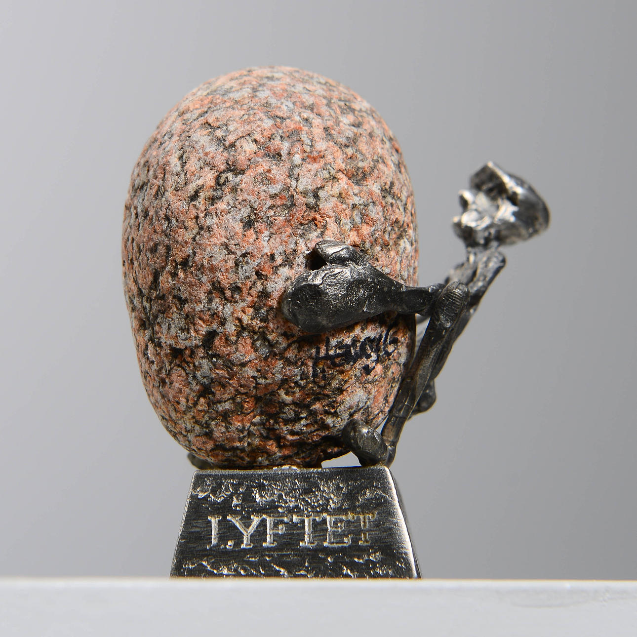 HENRY GUSTAFSSON. Sculpture, "Lyftet", pewter & stone, signed.