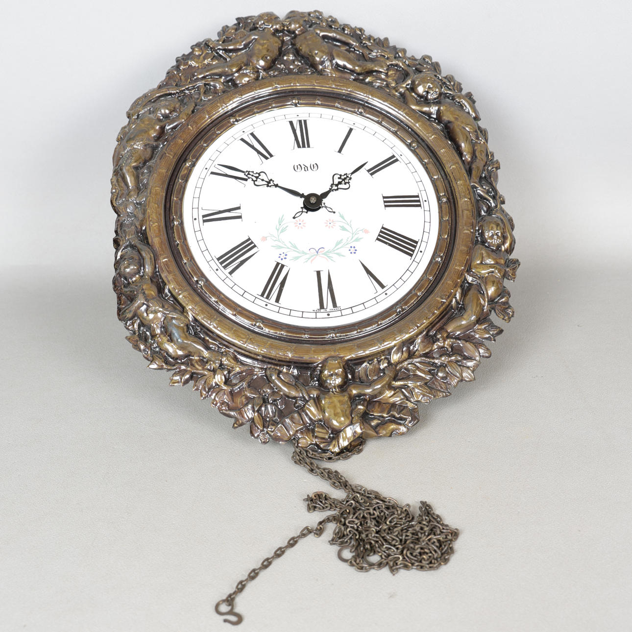 A 20TH CENTURY DUTCH REPOUSSE WALL CLOCK.