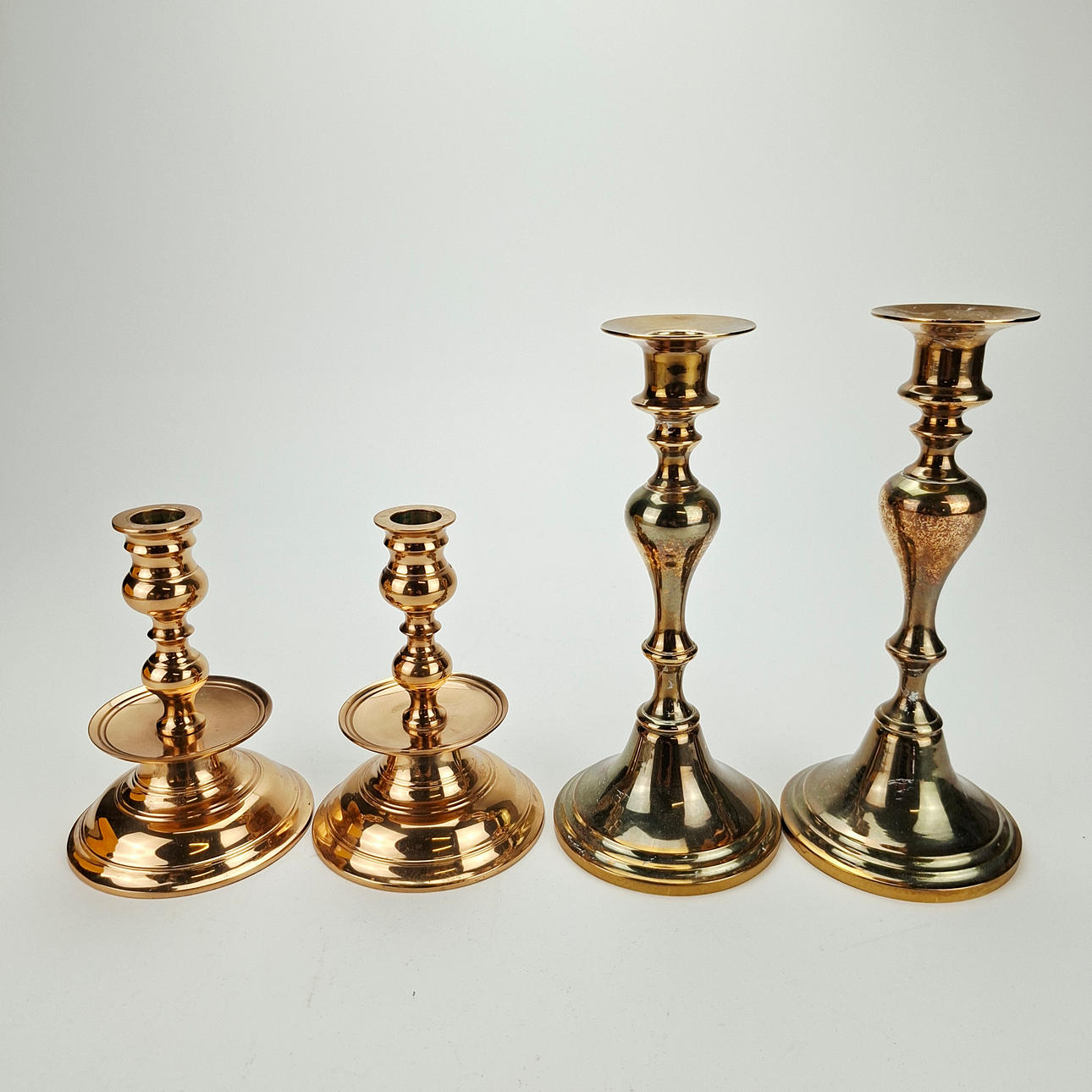 CANDLESTICKS, 2 pairs, brass, 20th century.