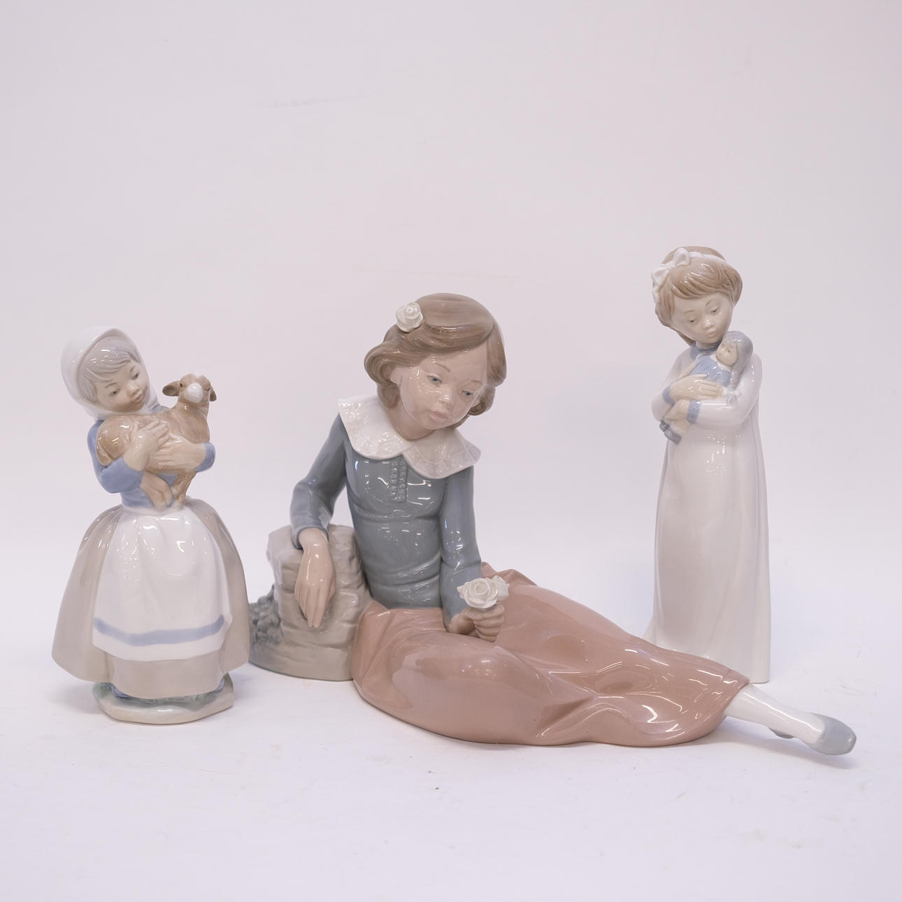 FIGURINES, NAO, THREE PIECES.