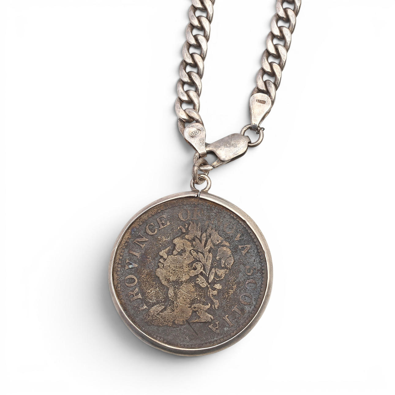 Pendant with a Canadian coin.