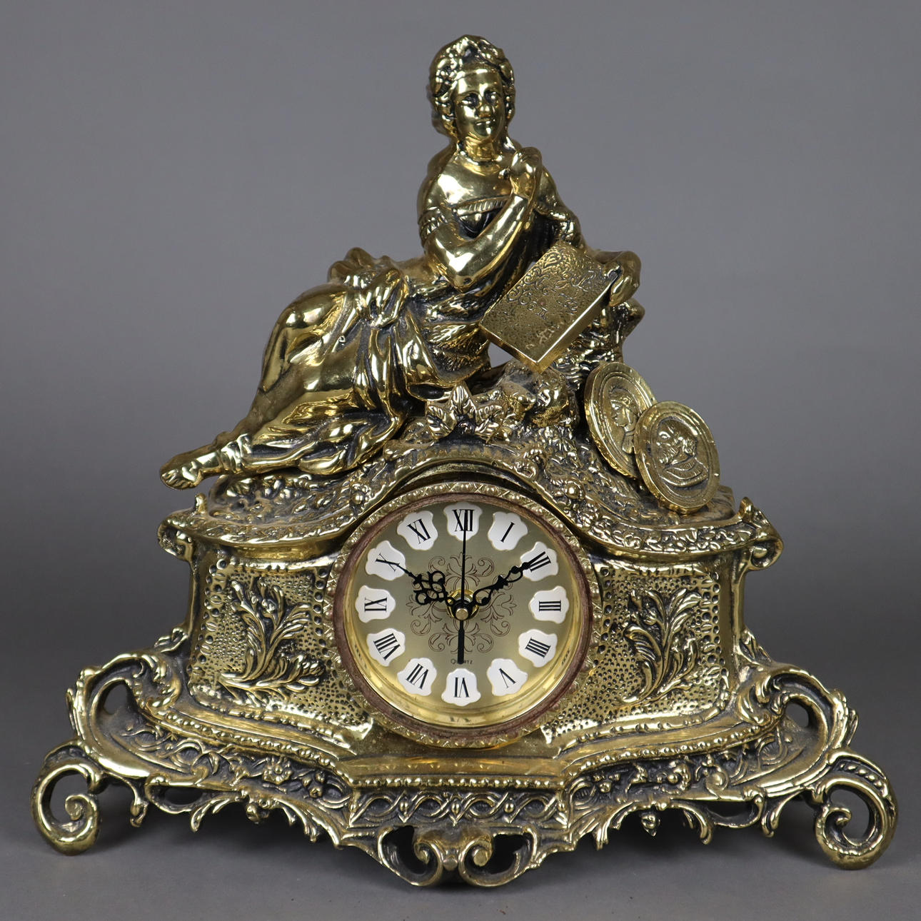 Figural TABLE CLOCK WITH RECLINING WOMAN.