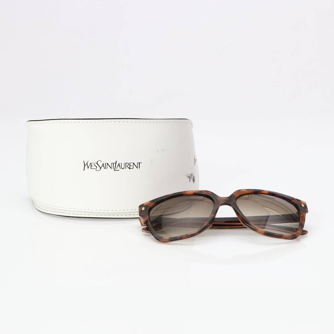 YVES SAINT LAURENT, SUNGLASSES. Tortoiseshell-patterned plastic.