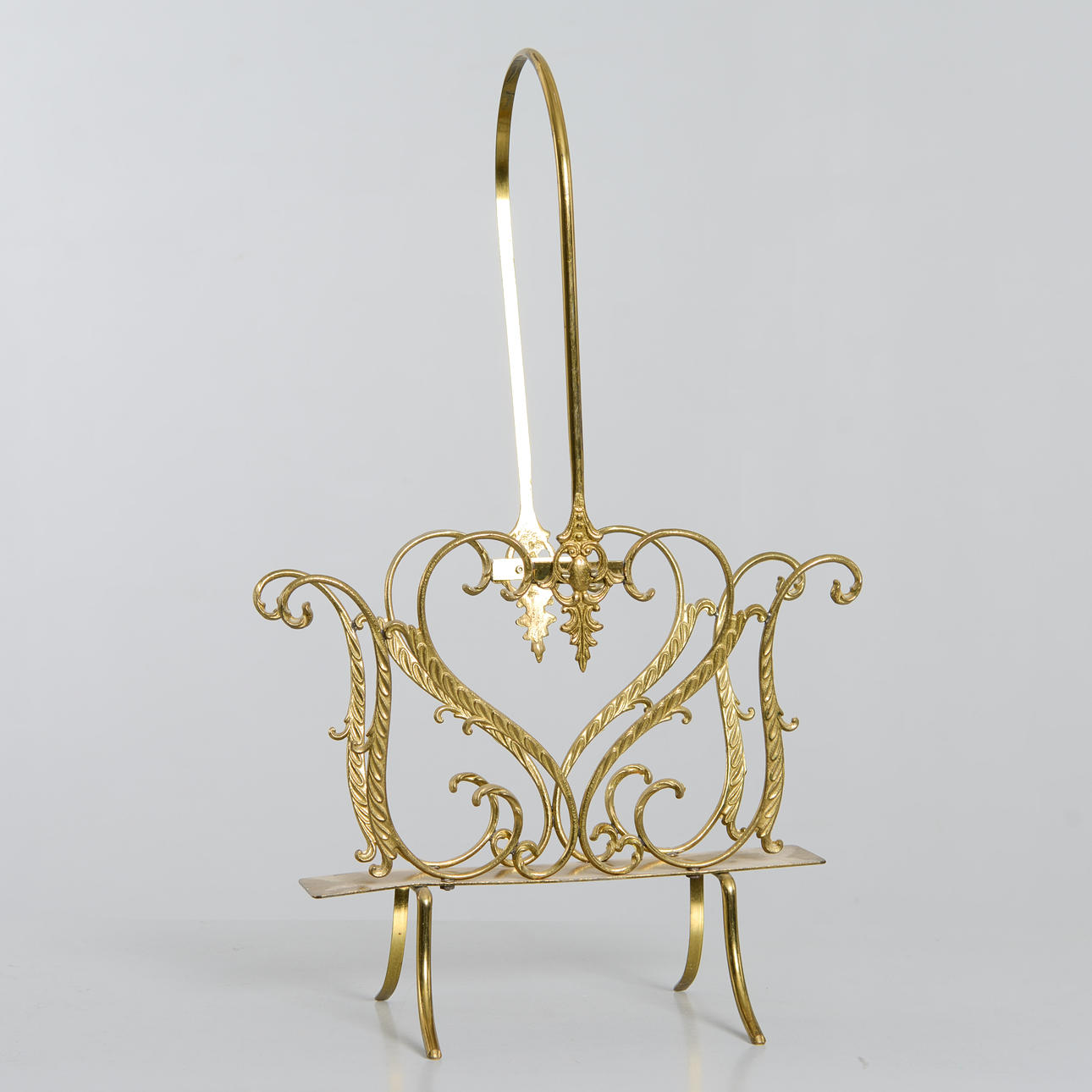 MAGAZINE RACK, brass, 20th century.