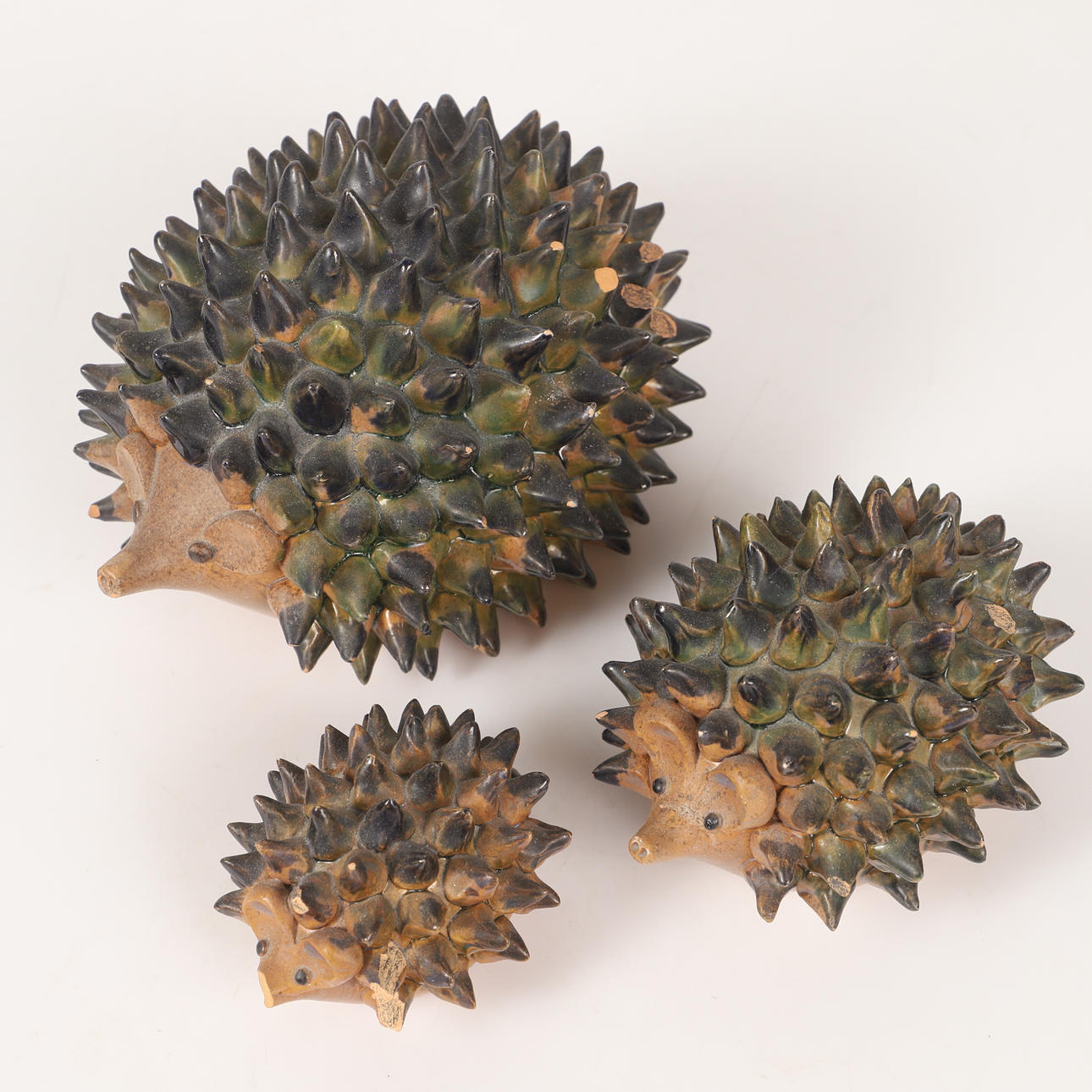 FIGURINES, 3 pieces, hedgehogs, glazed ceramic, signed Jacobsson.