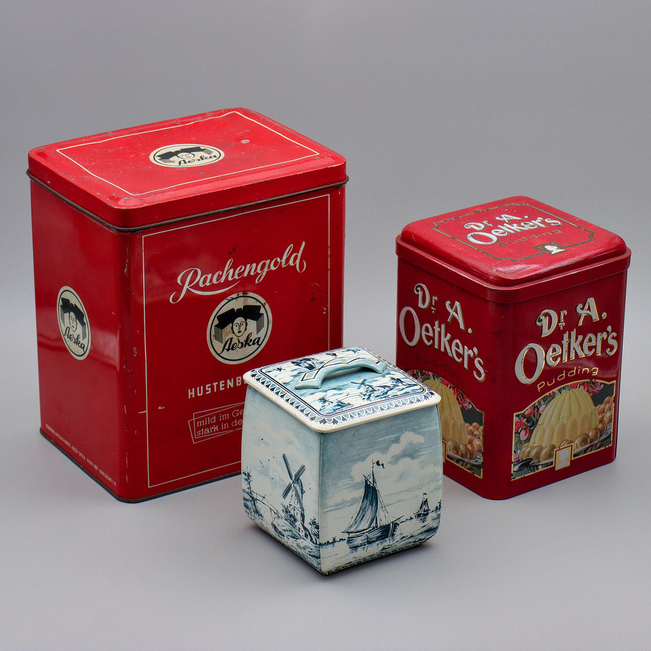 THREE VINTAGE TIN CANS.