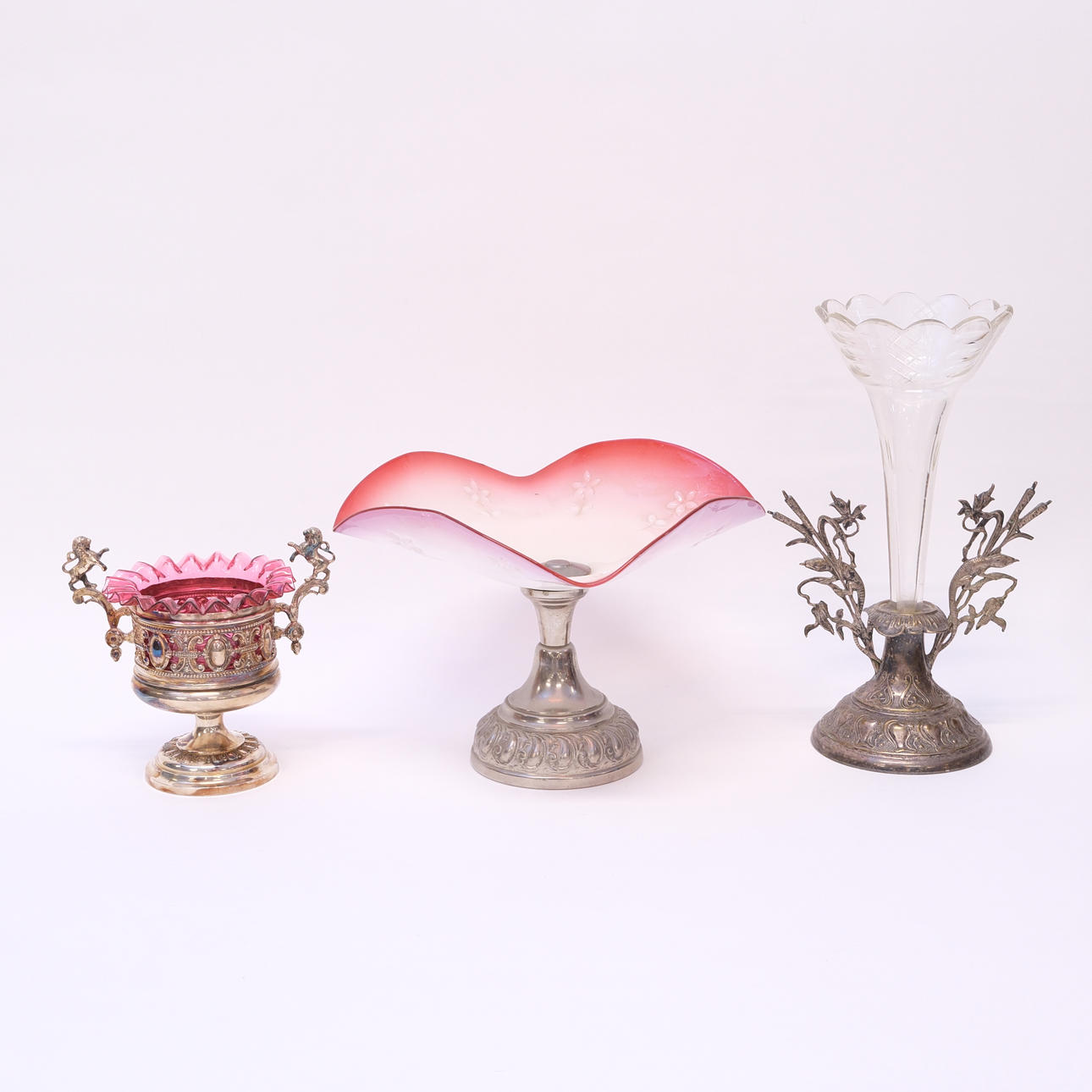 NICKEL SILVER WITH GLASS, THREE PIECES.