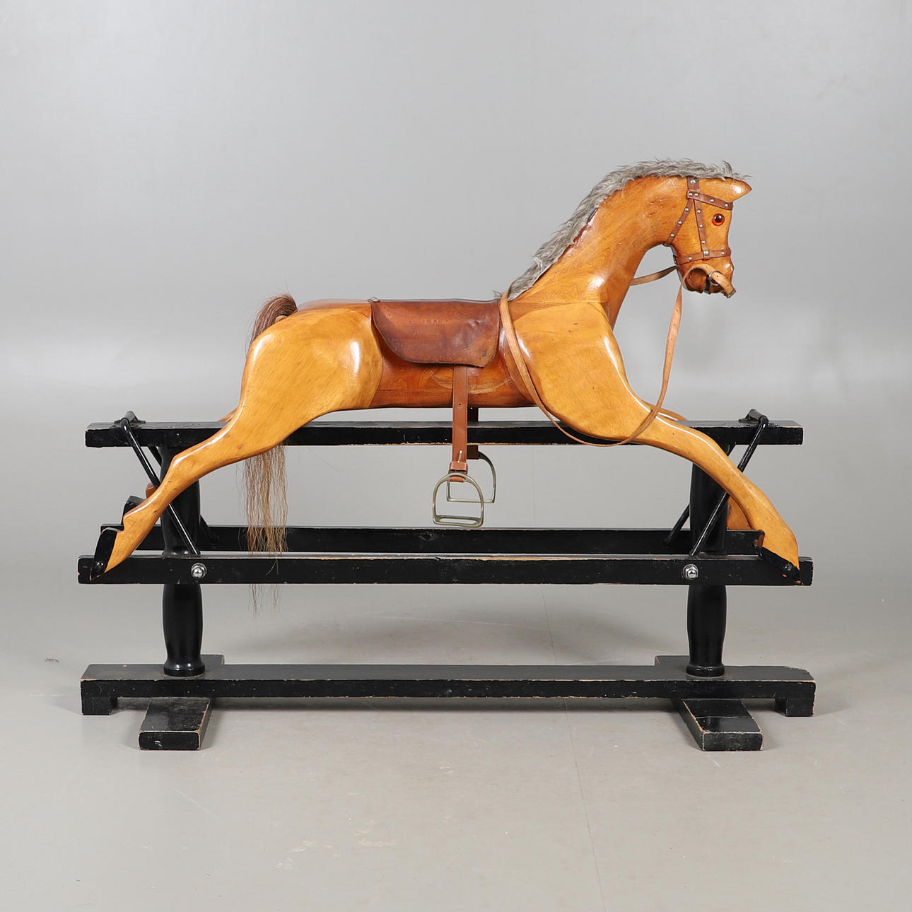 A MID-20TH CENTURY ROCKING HORSE.