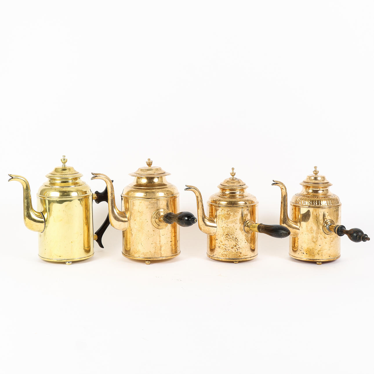 SERVING PITCHERS 4 pieces, brass.