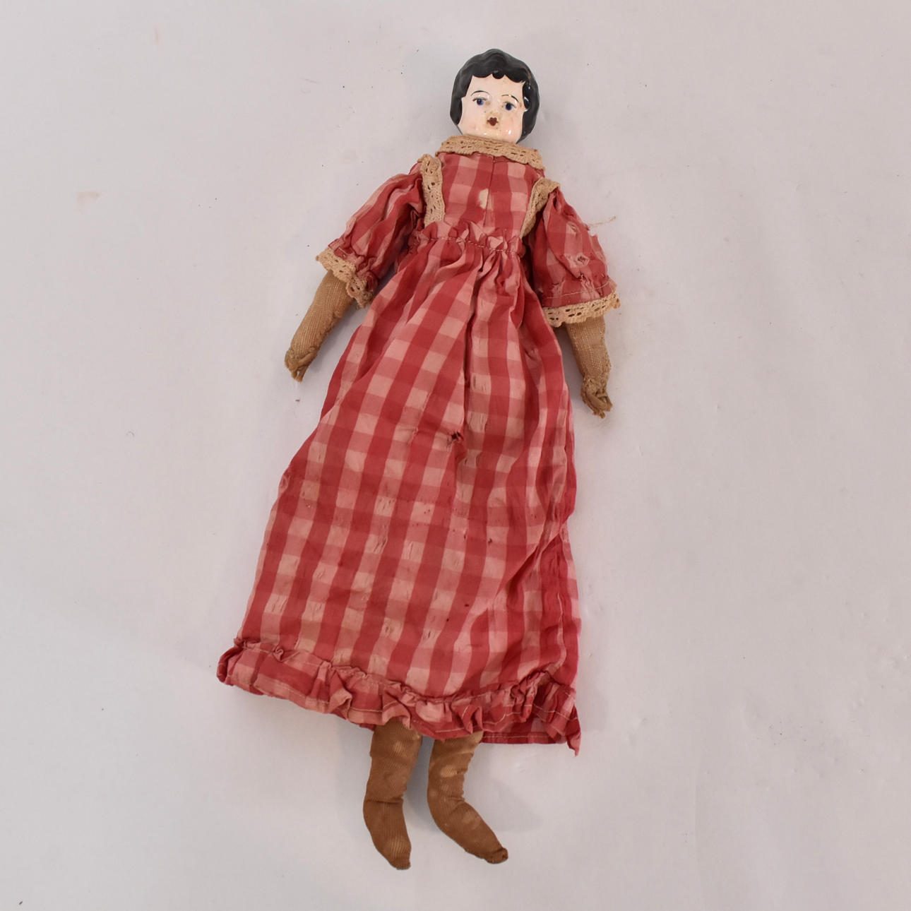 DOLL, porcelain head, 19th century.