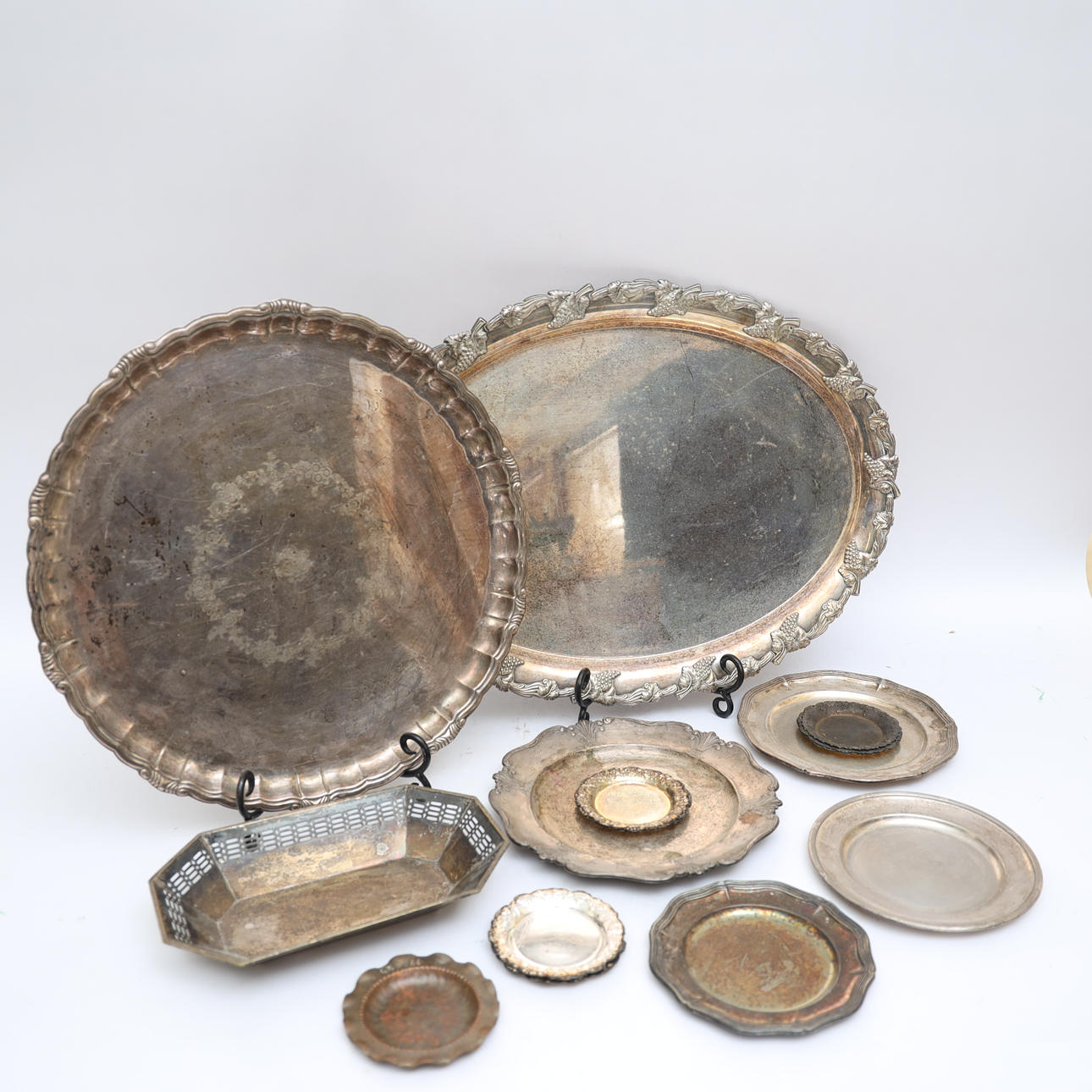 SERVING TRAY, mostly nickel silver, with relief decoration.