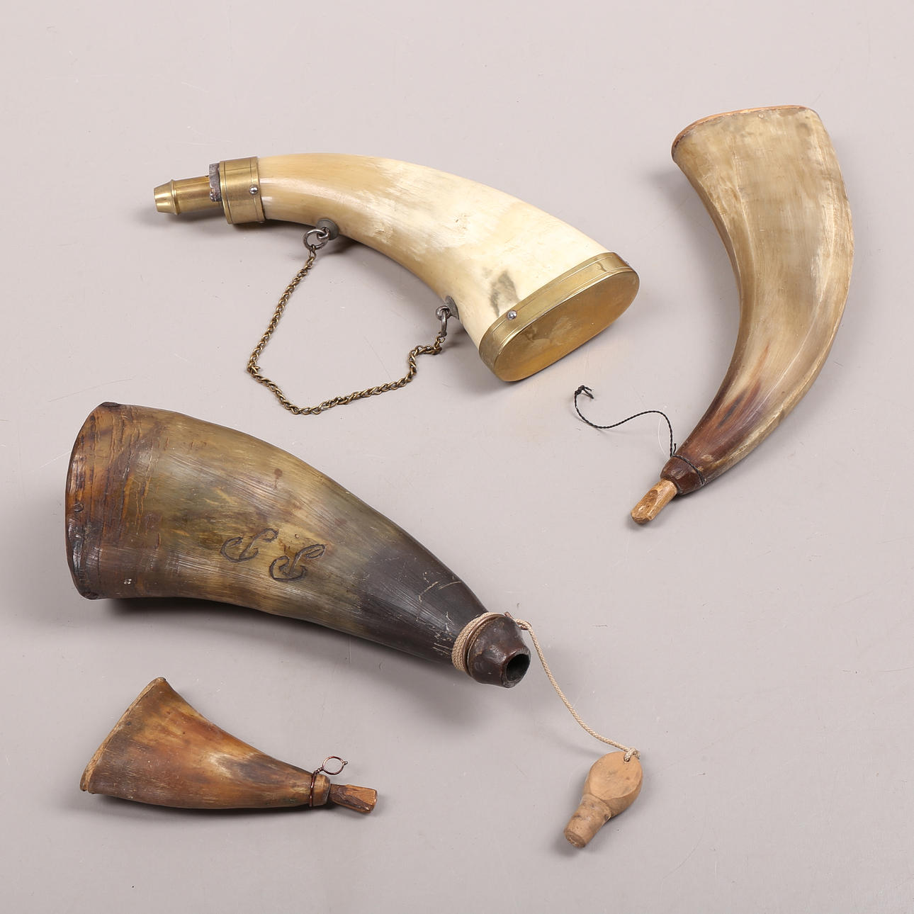 POWDER FLASKS, 4 pcs, 19th century.