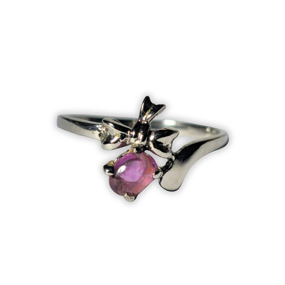 Silver ring with natural pinkish ruby.