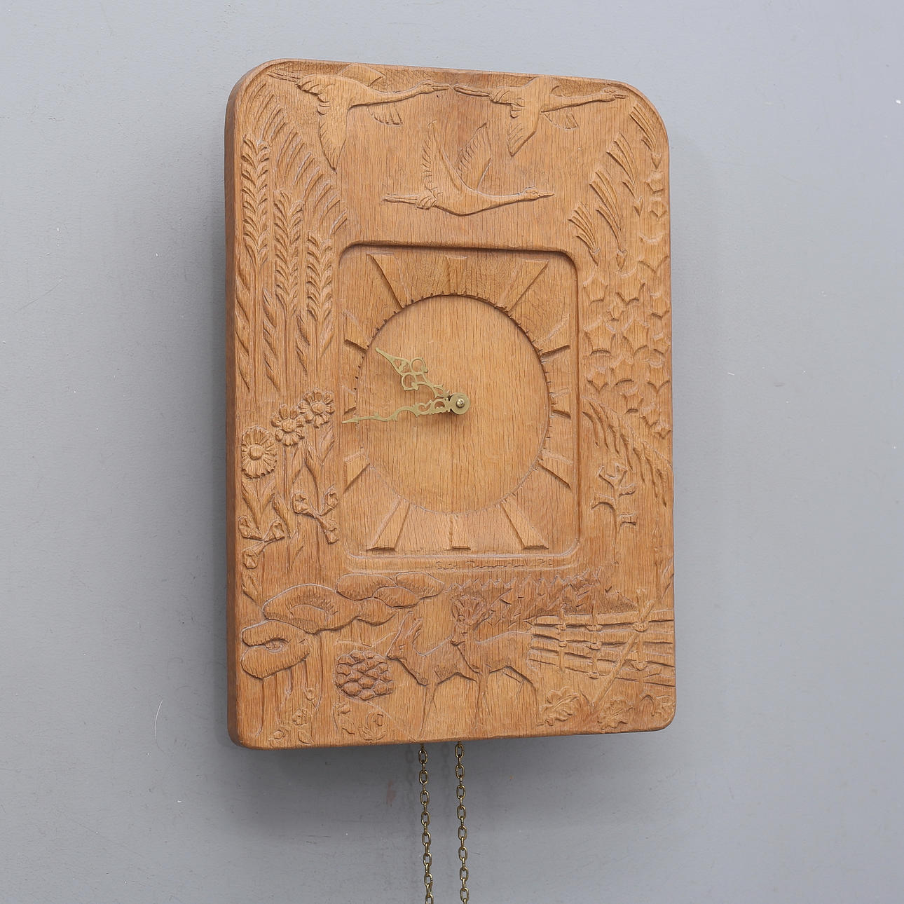 ERIK REIMHULT. WALL CLOCK, carved wood, signed, dated 72.