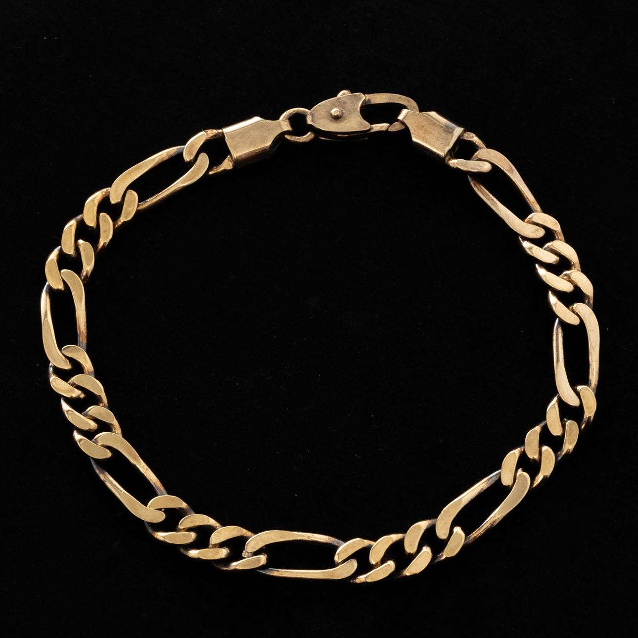 BRACELET, Figaro link, gold-plated sterling silver.