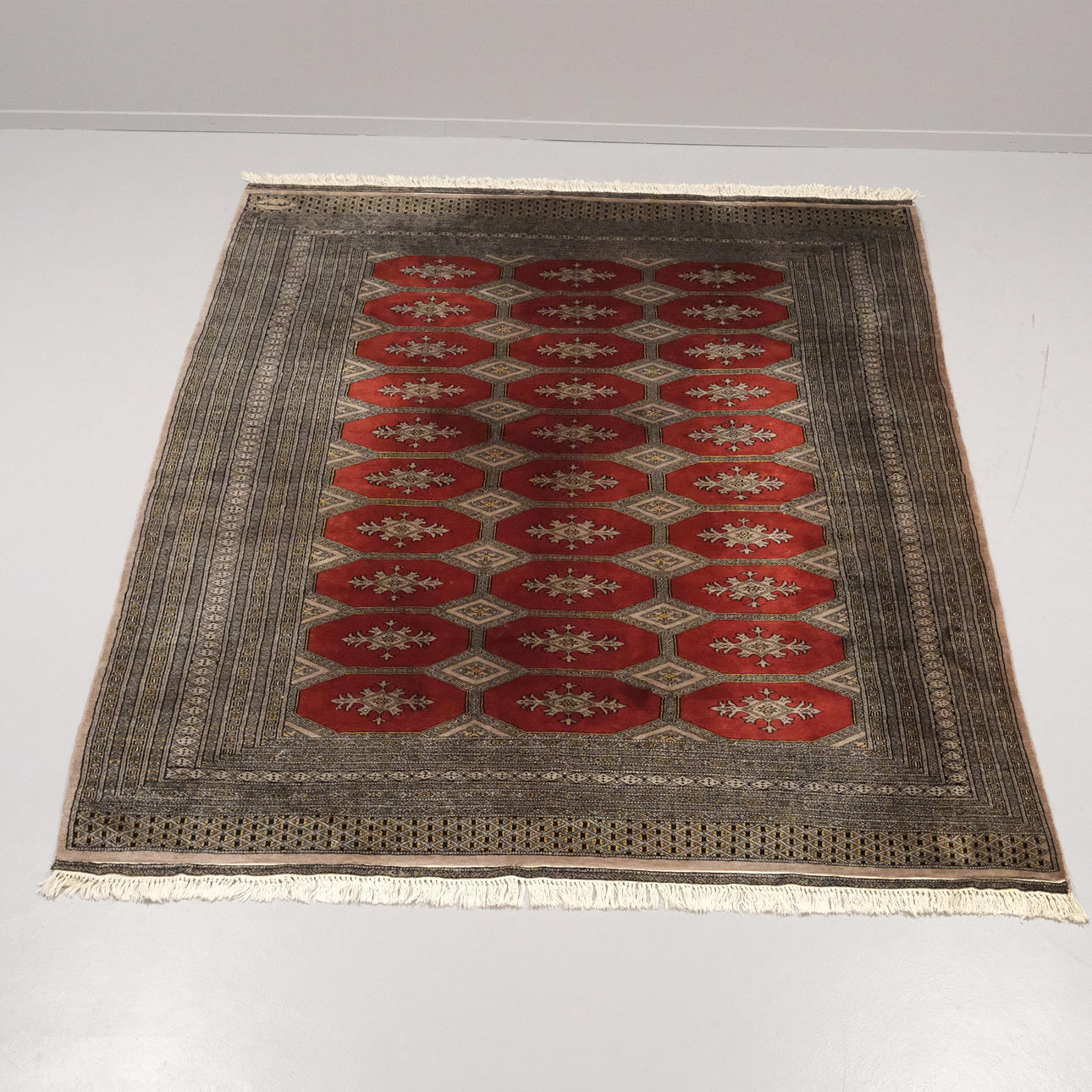 HAND-KNOTTED CARPET, BUCHARA STYLE.