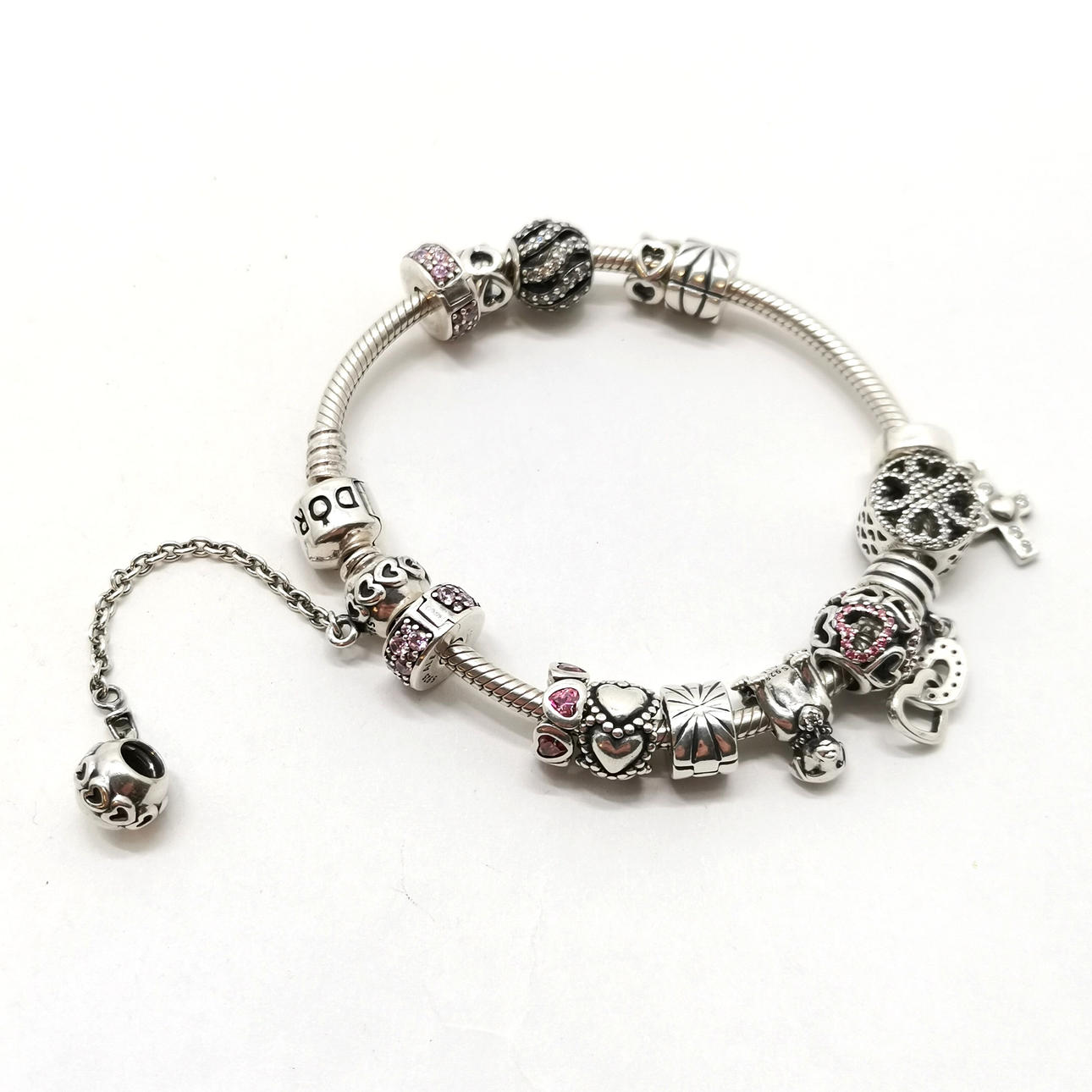 PANDORA SILVER BRACELET W/ CHARMS.