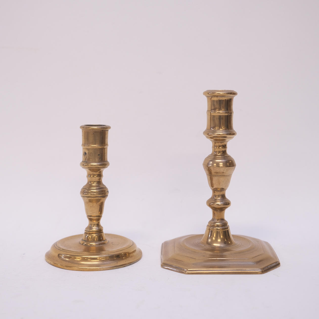 TWO CANDLESTICKS, BAROQUE STYLE, CIRCA 1800.