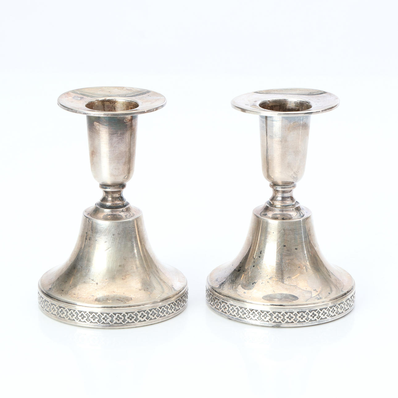 CANDLESTICKS, A PAIR. Silver, with weighted base.