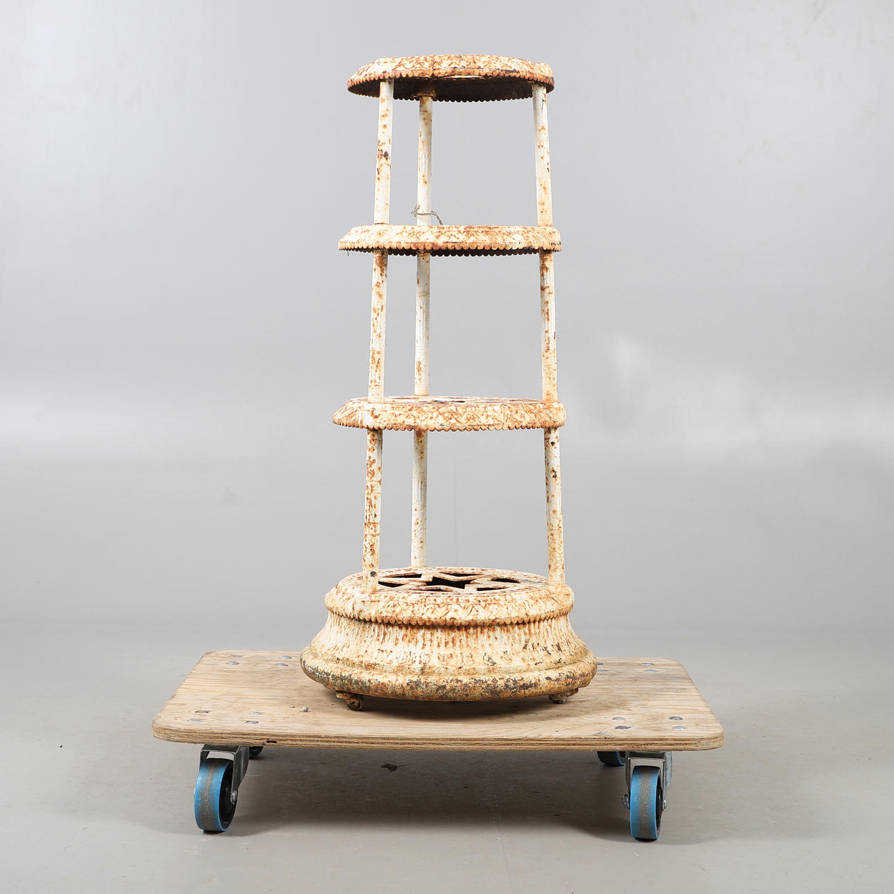 A KENRICK & SONS CAST IRON POT STAND.